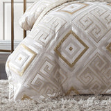 Elegant Super King Quilt Cover Set in gold on ivory with Greek key motif and textured chenille, perfect for luxurious decor.