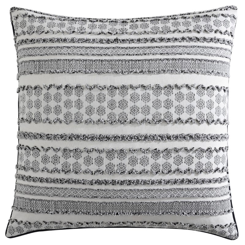 Luxurious European pillowcase with geo-tribal motifs, tufted textures, and black cord piping for a modern bedroom decor.