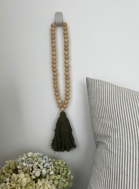 Elegant moss-colored beaded tassel measuring 55 x 2.5cm, perfect for home decor and DIY projects.