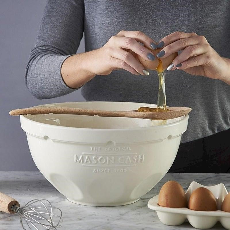 Mason Cash 29cm white mixing bowl with ergonomic design, chip-resistant earthenware, and unique grip spots for stability.