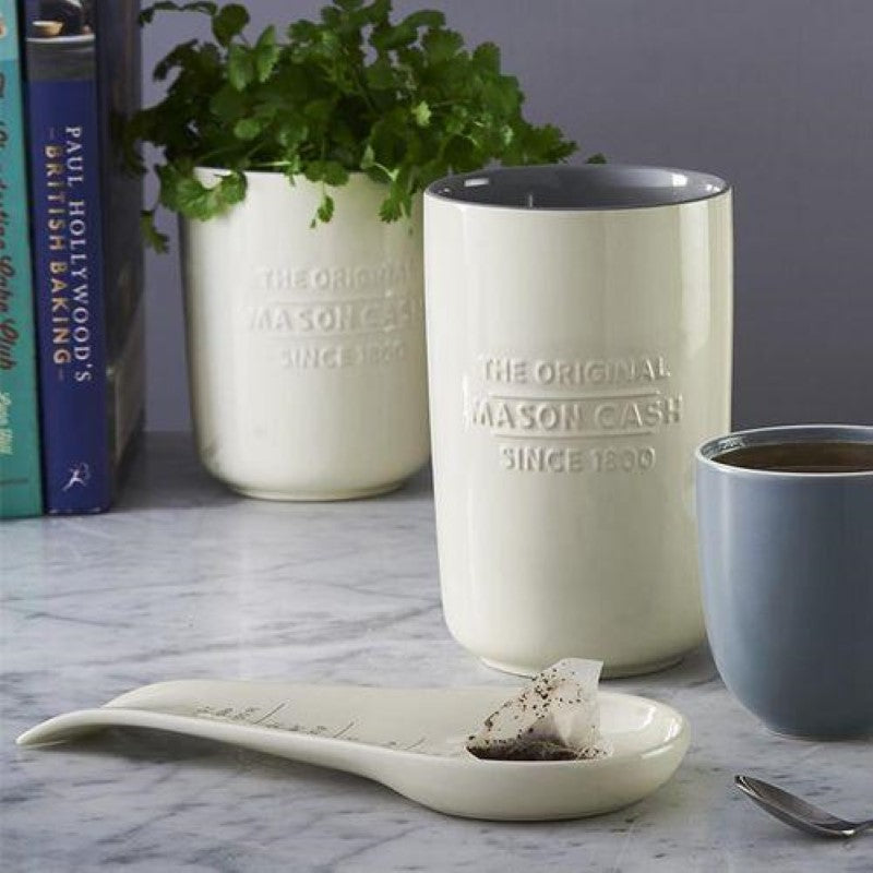 Mason Cash Spoon Rest in earthenware, neutral color, with measurement guides—perfect for keeping utensils organized and counters clean.