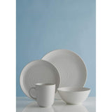 Elegant set of 4 white mugs with embossed ripple design and coupe edge, made from durable stoneware for everyday use.