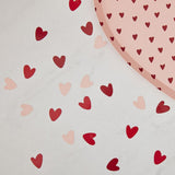 Biodegradable pink and red heart confetti, perfect for romantic events while being eco-friendly and plastic-free.