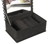 Elegant black and white jewellery box with multiple compartments for organized and tangle-free accessory storage.