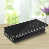 Sleek black Odyssey Wireless Charging Power Bank with 10,000mAh capacity and 5W wireless charger for on-the-go device charging.