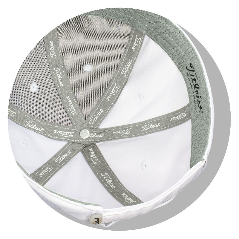 White Titleist Performance Ball Marker Cap with moisture-wicking fabric, UV protection, and integrated ball marker for golfers.