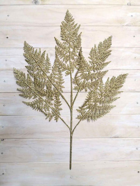 Gold glitter artificial fern spray, 63 cm long, perfect for elegant decor and versatile arrangements without maintenance.