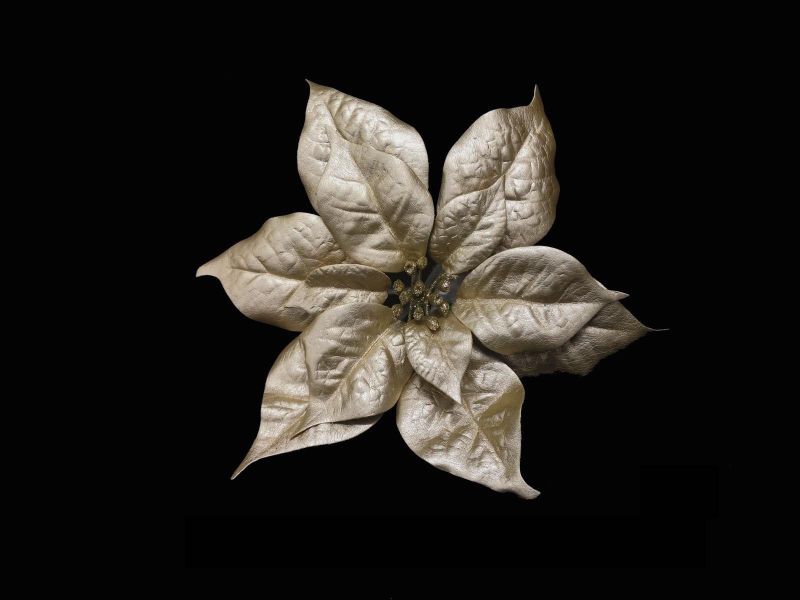 Gold artificial poinsettia head on pick, perfect for elegant holiday decor and versatile arrangements without maintenance.