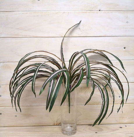 Lifelike artificial spider plant bush featuring vibrant green and red foliage, perfect for home or office decor.