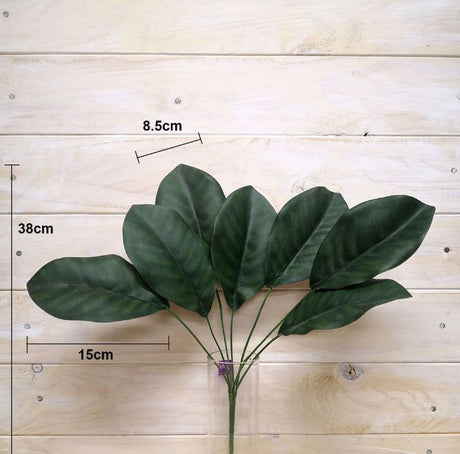 Large artificial magnolia leaf bush in lush green, perfect for stylish home and event decor without maintenance.