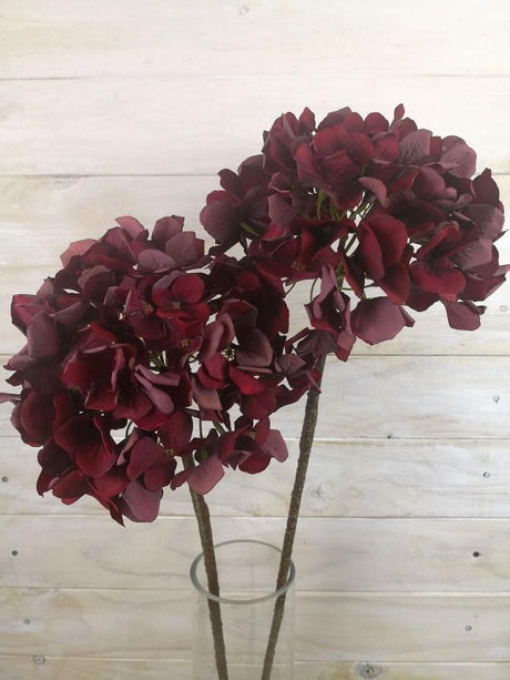 Vibrant red artificial hydrangea stem with a dry look, perfect for long-lasting floral arrangements and home decor.