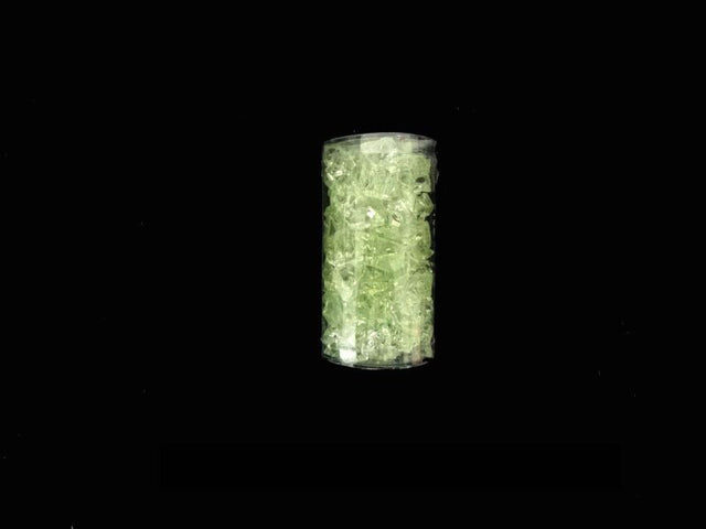 Sleek green ice cylinder for chilling drinks, reduces waste, ideal for gatherings, and enhances beverage presentations.