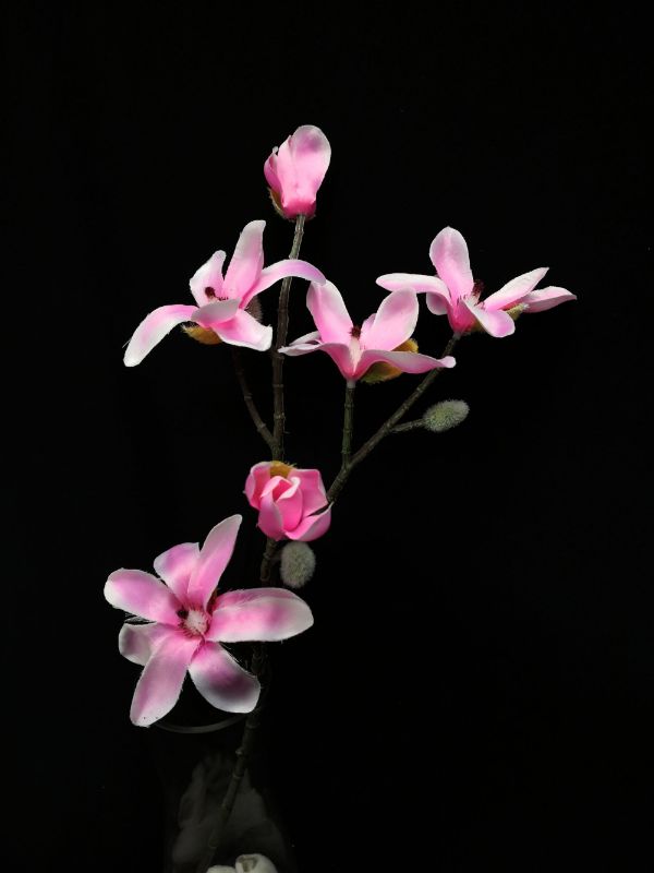 Lifelike pink artificial Star Magnolia stem, perfect for floral arrangements and adding elegance to any decor.