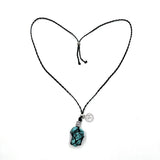 Braided necklace featuring turquoise and howlite stones, 75cm long, perfect for layering or making a bold statement.