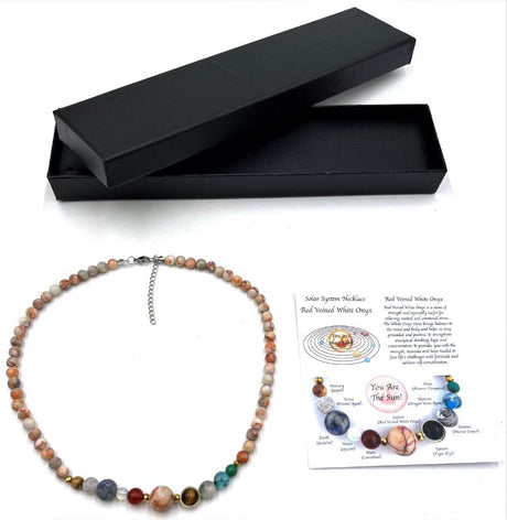 Solar System Necklace featuring 0.6 cm Red Veined White Onyx beads, combining elegance with cosmic charm for any outfit.