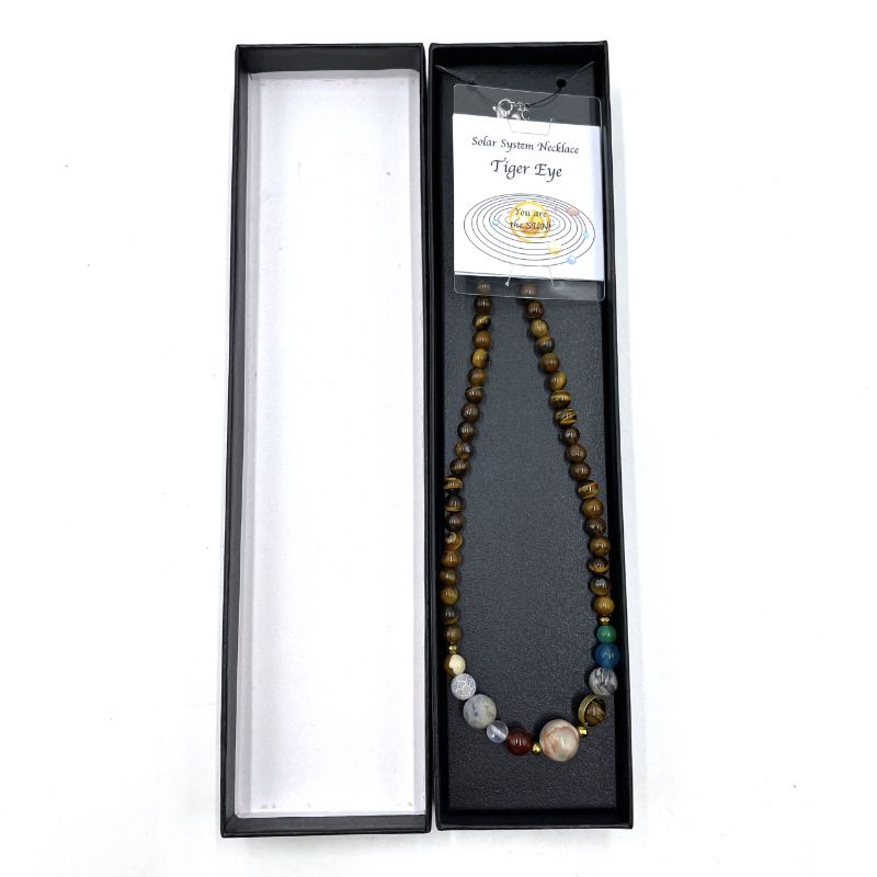 Tiger eye beads in a cosmic-inspired necklace, promoting emotional stability and versatility for any outfit.