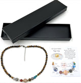 Tiger Eye beads necklace inspired by the solar system, promoting balance and emotional stability in a stylish design.