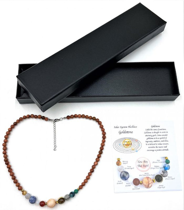 Solar System Necklace featuring sparkling goldstone beads and crafted planet ornaments, perfect for astronomy lovers.