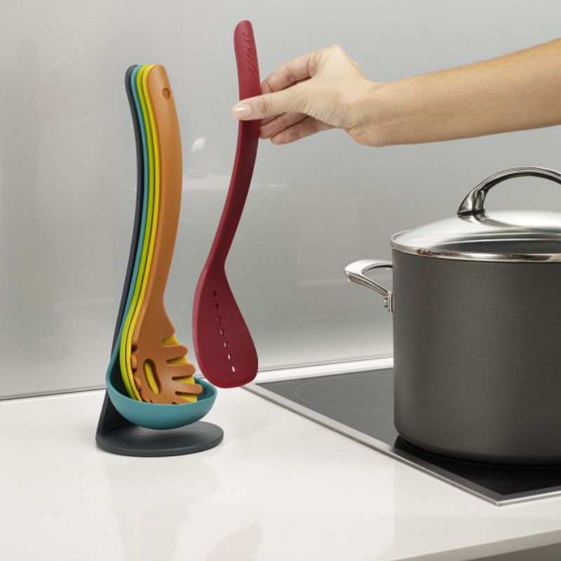 Colorful kitchen utensils set with five nested tools, featuring magnetic handles and a stylish storage stand.