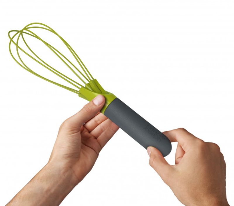 Joseph Joseph Twist Whisk in Grey/Green, a versatile kitchen tool that transforms from flat to balloon whisk for efficient mixing.