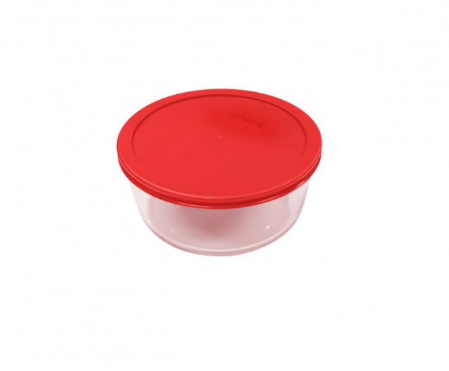 Round Pyrex 2-Cup container with red lid, perfect for food storage; made from durable, microwave-safe tempered glass.