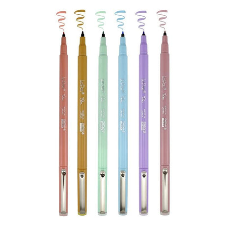 Pastel-colored MARVY Le Pen Flex markers with flexible brush tips for hand lettering and creative projects.