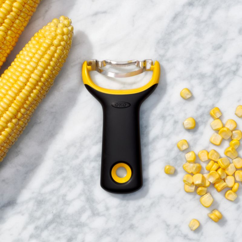 Ergonomic OXO Good Grips Corn Prep Peeler with sharp stainless steel blade for easy, mess-free corn kernel removal.