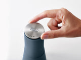 Stylish sky blue salt and pepper mill set with top-grinding mechanism for mess-free seasoning in the kitchen.