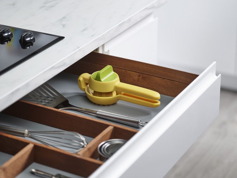 Two-stage citrus press with easy-squeeze handles and twist knob for maximum juice extraction from lemons and limes.