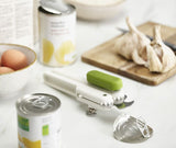 Joseph Joseph's Pivot 3-in-1 Can Opener in white and green, featuring a can opener, bottle opener, and ring-pull lifter.