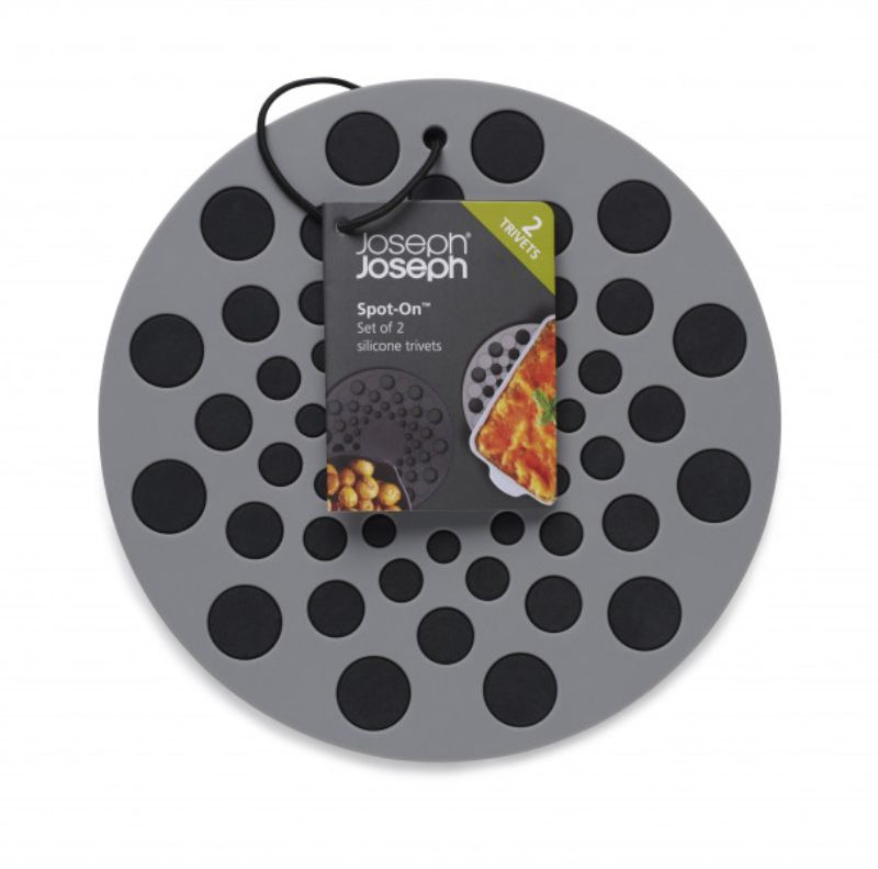 Grey round silicone trivets by Joseph Joseph, heat-resistant, with raised dot design for grip and modern kitchen style.