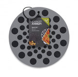 Grey round silicone trivets by Joseph Joseph, heat-resistant, with raised dot design for grip and modern kitchen style.