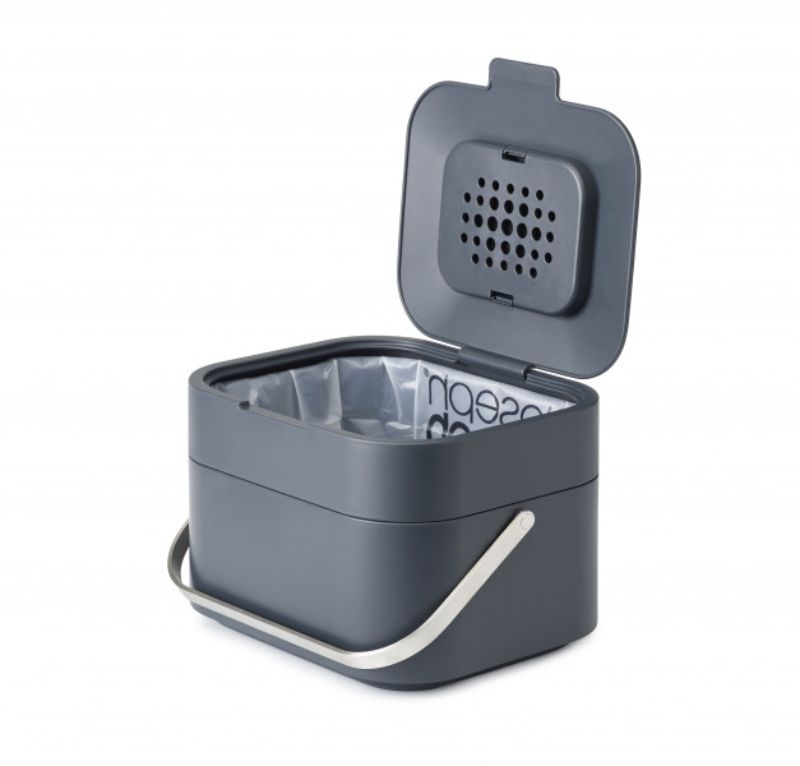 Joseph Joseph Stack 4 in Graphite, a ventilated food waste caddy with odor filter, stainless steel handle, and easy-clean design.