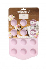 Flexible 12-cup mini muffin pan designed for easy baking and release of bite-sized treats, ideal for any occasion.