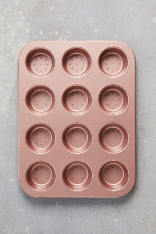 Wiltshire perforated tart & quiche pan with 12 cups in elegant rose gold for perfect pastries and easy cleanup.