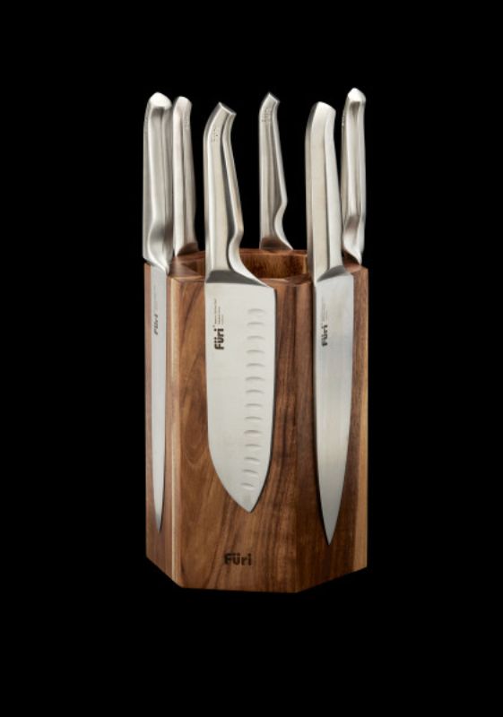 Hexagonal knife block made of acacia wood, securely holds up to 12 Furi knives with magnetized surfaces for easy access.