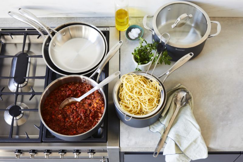 Stanley Rogers 18cm professional saucepan featuring durable BI-PLY construction, cool-touch handle, and glass lid for safe cooking.