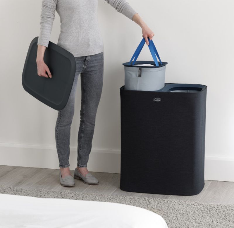 Joseph Joseph Tota 90-litre laundry basket with dual tote bags for easy fabric separation, featuring a sleek carbon black design.