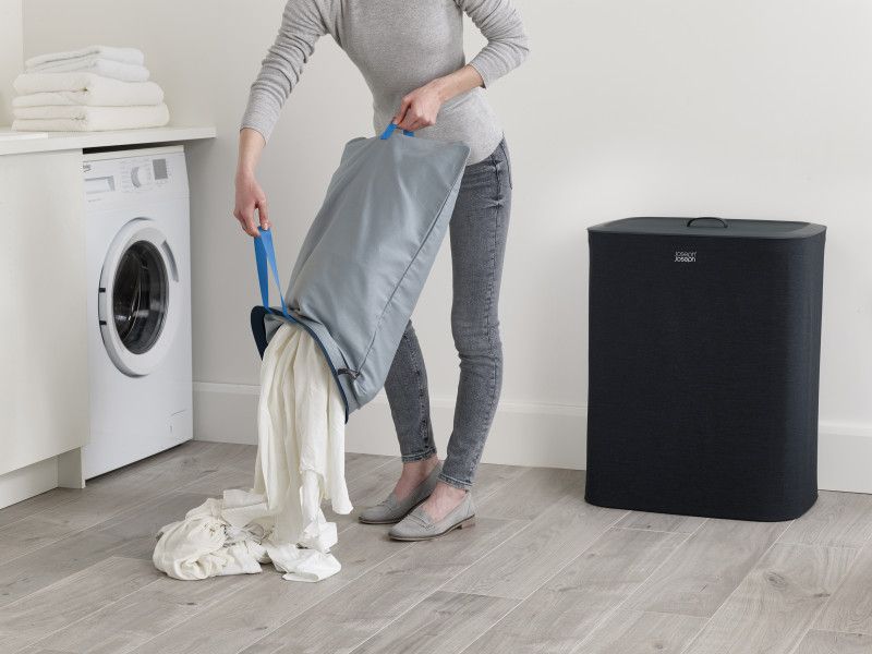 Joseph Joseph Tota 90-litre laundry basket in Carbon Black with dual 45-litre bags for easy fabric separation and stylish design.