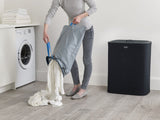 Joseph Joseph Tota 90-litre laundry basket in Carbon Black with dual 45-litre bags for easy fabric separation and stylish design.