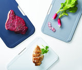 Joseph Joseph Nest Boards set in grey with three color-coded chopping boards and sleek storage stand for organized kitchen prep.