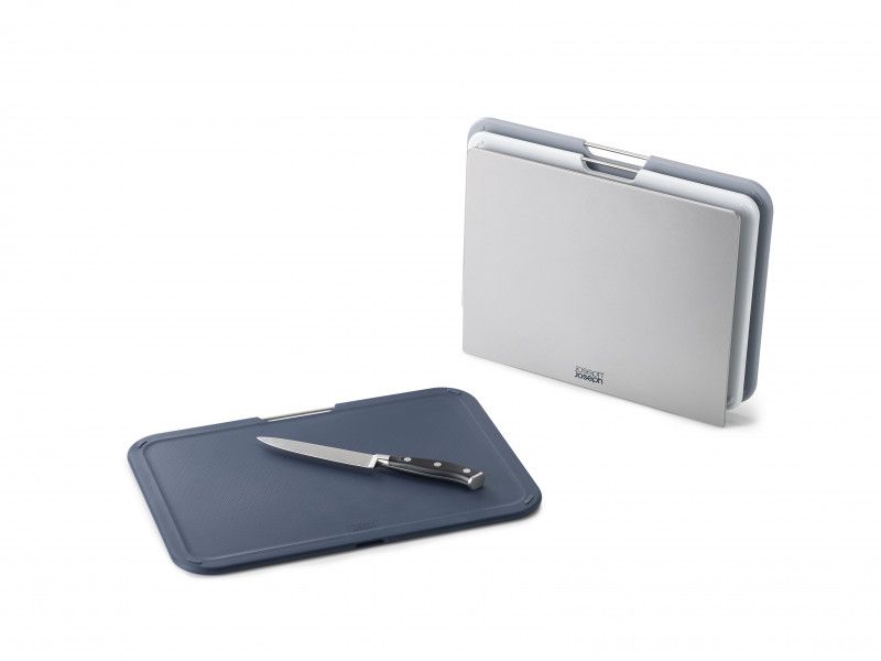 Joseph Joseph Nest Boards Large 3 Piece Set in Grey, featuring non-slip feet, stainless-steel lift bar, and stylish storage stand.