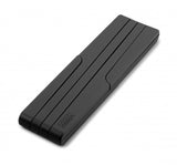 Expandable black silicone trivet from Joseph Joseph, heat-resistant and foldable for easy storage in modern kitchens.