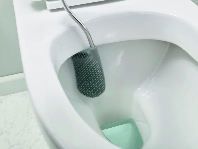 Joseph Joseph Flex Lite Toilet Brush in grey with flexible D-shaped head for thorough, hygienic toilet cleaning.