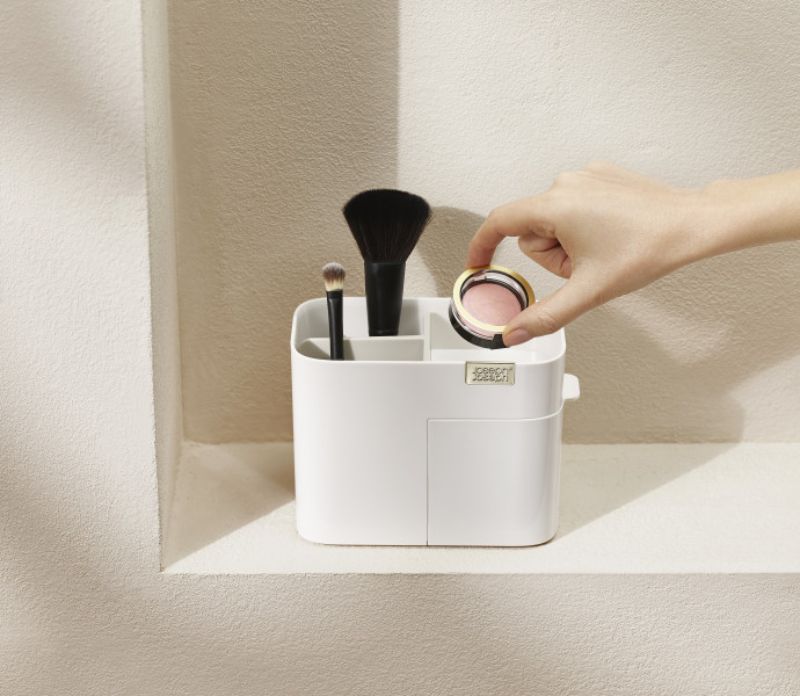 Compact cosmetic organiser in Shell with deep compartments and a magnetic drawer for makeup storage. Stylish & space-saving.