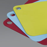 Colorful set of 3 flexible chopping mats with knife-friendly surfaces and hygienic, color-coded designs for safe food prep.