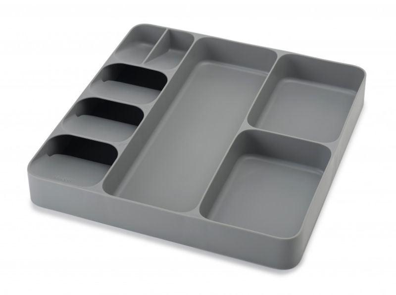 Joseph Joseph grey cutlery and utensil organiser features overlapping compartments for efficient storage in kitchen drawers.