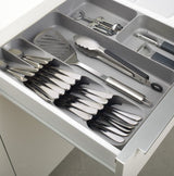 Joseph Joseph DrawerStore organiser in grey with five cutlery slots and three deep compartments for utensils and gadgets.