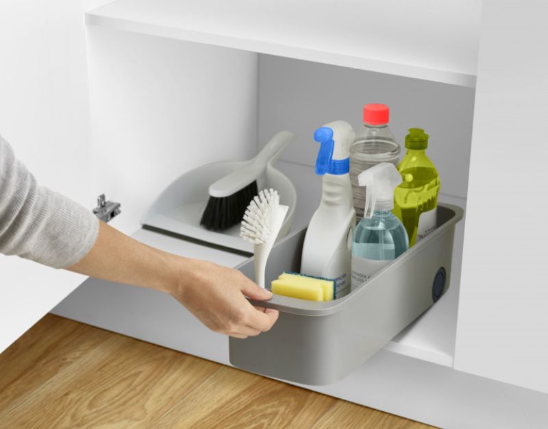 Joseph Joseph CupboardStore caddy in grey, featuring compartments for cleaning supplies and smooth-rolling wheels for easy access.