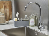 Joseph Joseph DoorStore Sink Tidy in grey, a compact caddy for organizing cleaning supplies within your cupboard.